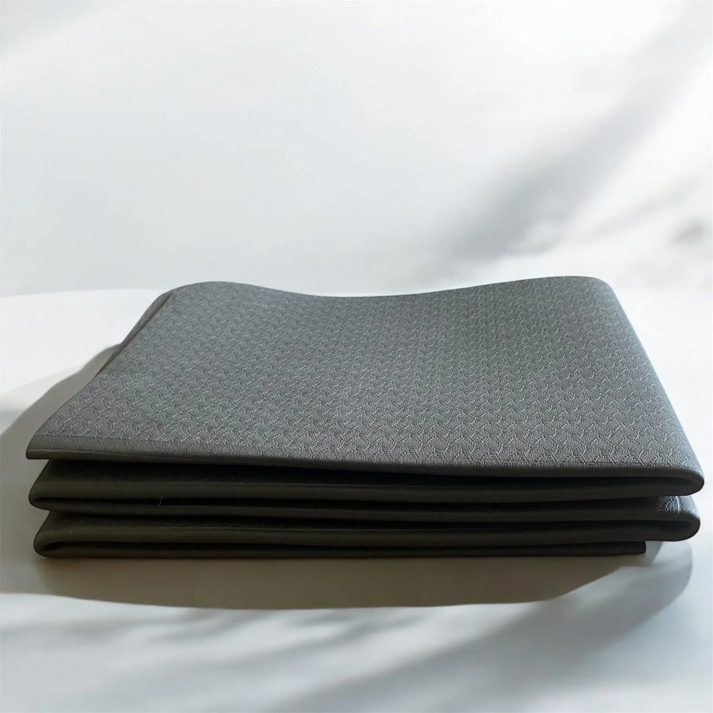 Tapis de pilates pliable, léger et pratique, idéal pour le Kit Pilates complet.